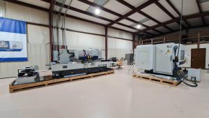 robbi meeting with Ecotech Machine Tool, inside of showroom warehouse