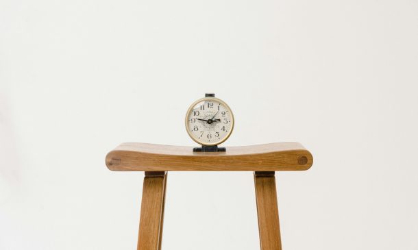 clock on a table, white background